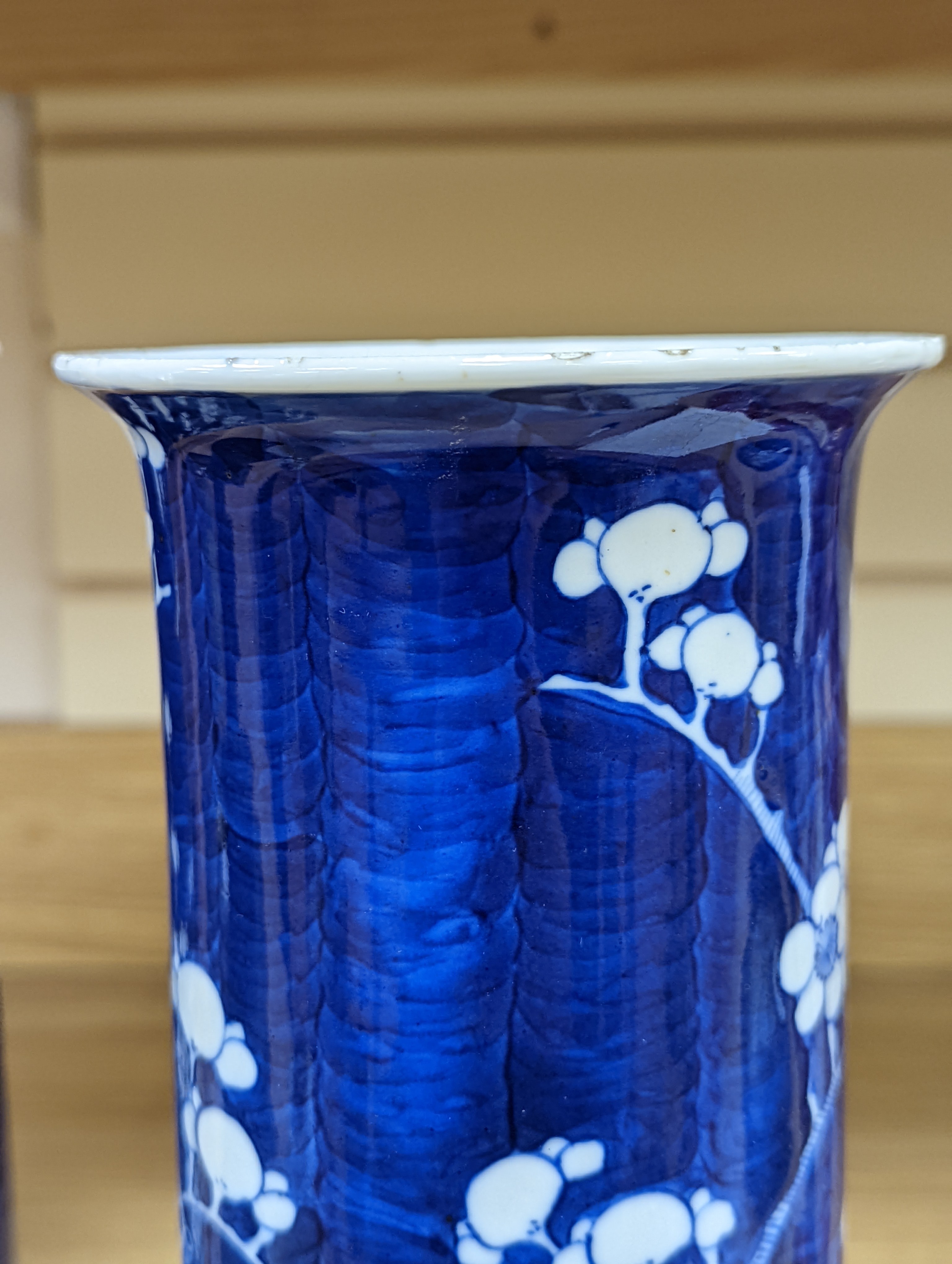 An 18th century Chinese famille rose mug, a Chinese Imari tea caddy and two Chinese blue and white sleeve vases 30cm (4)